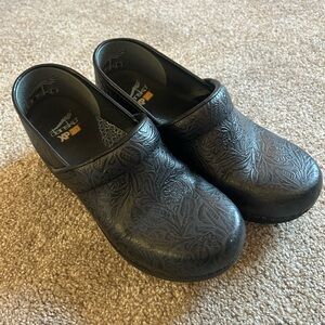 Dansko Black Leather Tooled Clogs